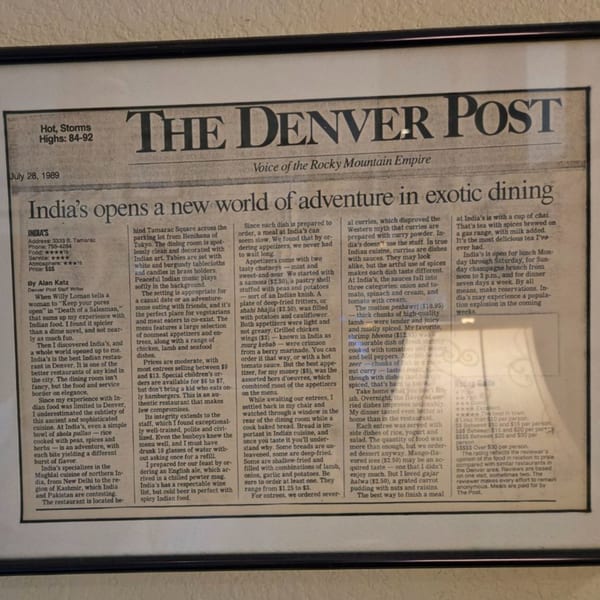 A framed newspaper clipping from The Denver Post, dated July 28, 1989, reviewing INDIA'S Restaurant.