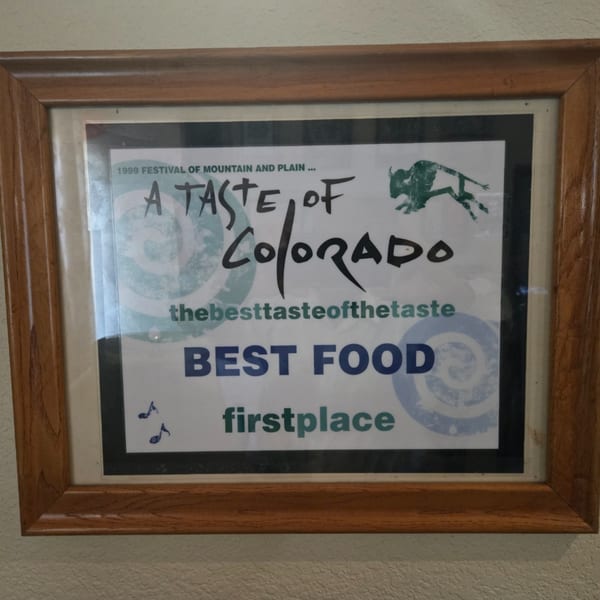 Framed award certificate for "Best Food, First Place" from the 1999 "A Taste of Colorado" festival.